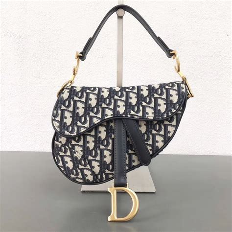 saddle pouch blue dior oblique jacquard price|Dior saddle bag with strap.